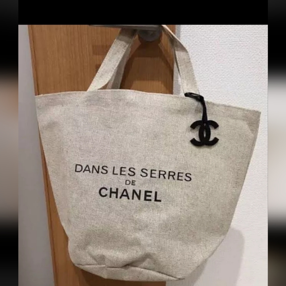 CHANEL Beige Canvas Tote with Black CC Charm